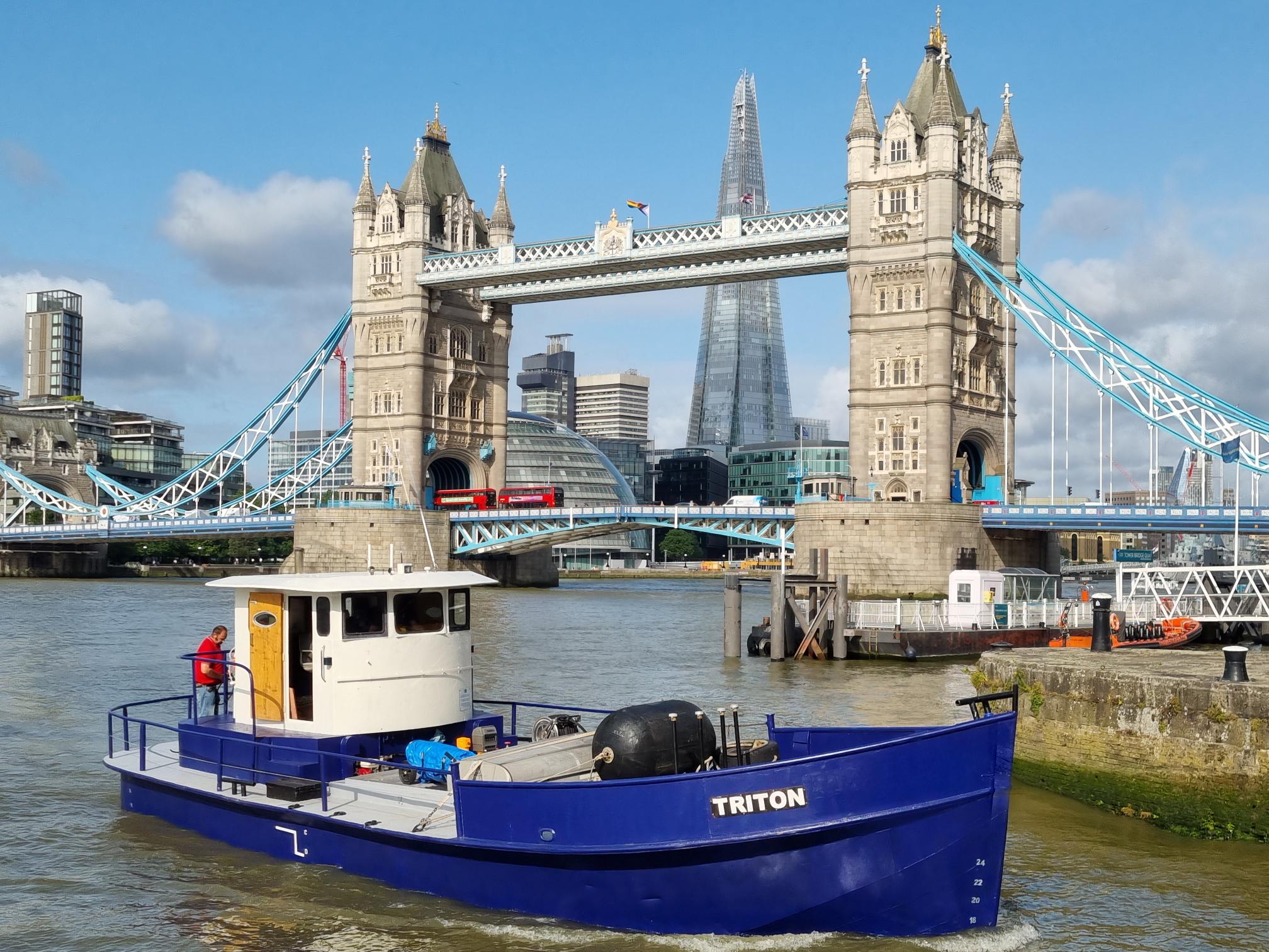 Triton barge near Tower Bridge on the Thames