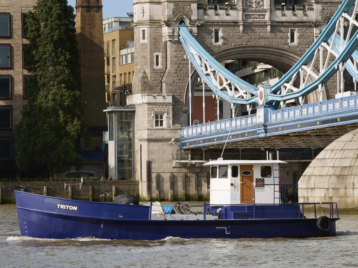 Triton fuel barge passing Tower Bridge